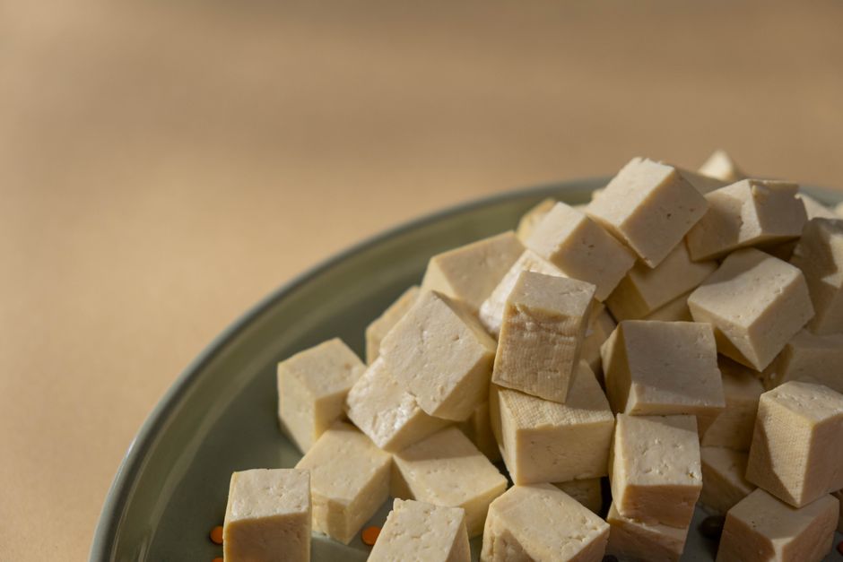 Cubes of tofu piled on a plate